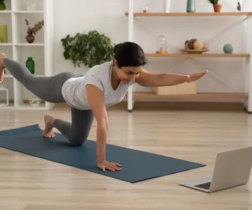 Woman getting a virtual workout from her home