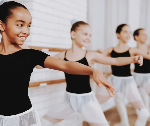 Ballet Training of Group of Young Girls Indoors