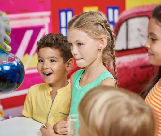 Science show for kids. Colorful liquid with steam and smoke