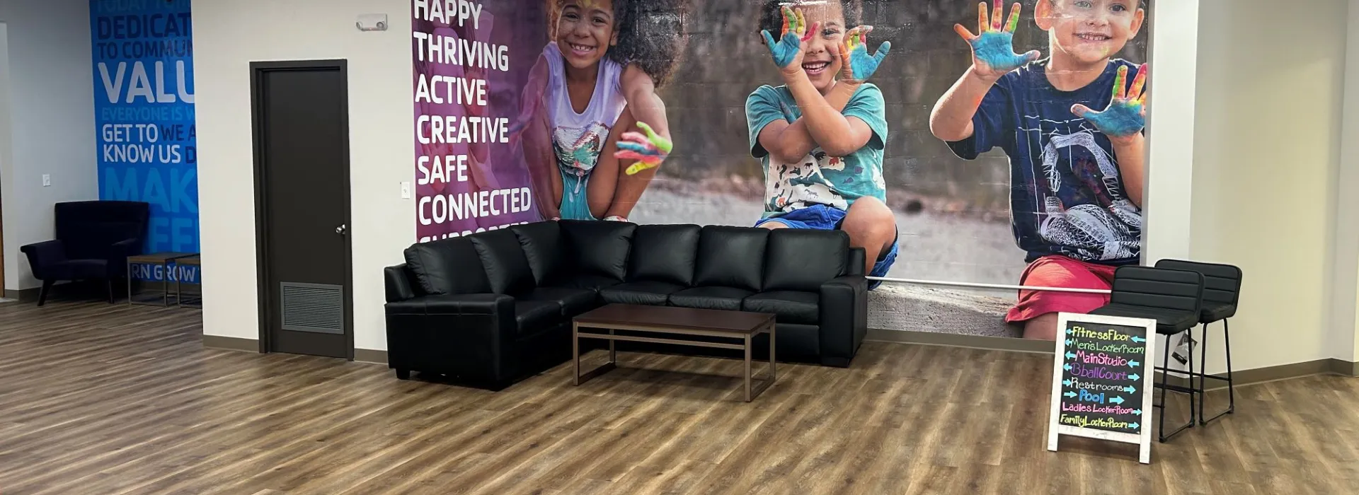 New lobby with a nice seating area for families with murals in the background